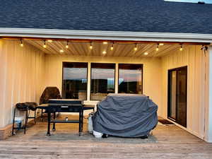 Exterior space with wooden ceiling and wood-type flooring