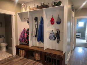 Mudroom featuring wood flooring