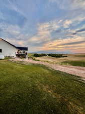 Yard at dusk with a rural view