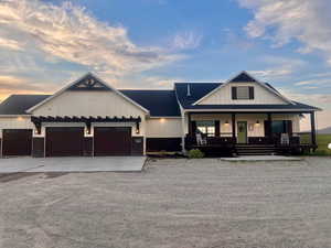 Modern farmhouse with a garage and a porch