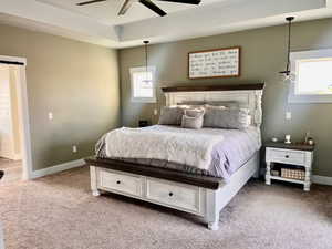 Carpeted bedroom with ceiling fan