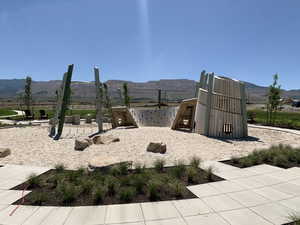 View of playground with a mountain view