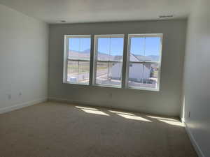 Empty room featuring carpet (photos are not of actual home this is a previously built home)