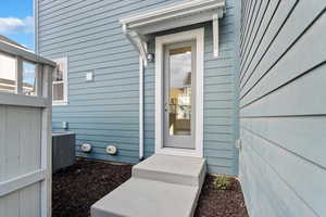 Property entrance with central air condition unit