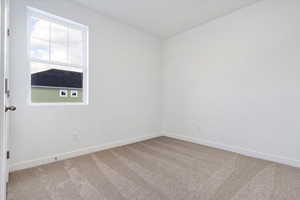 View of carpeted spare room