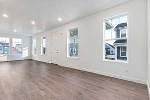 Entryway with hardwood / wood-style floors