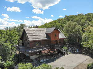 Rear view of property featuring a wooden deck