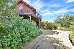 Back of house with a wooden deck