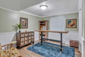 Bedroom in basement with wainscoting