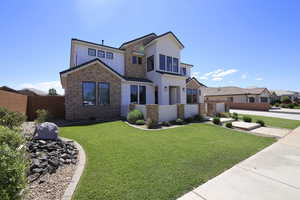 View of front of home featuring a front lawn