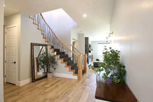 Foyer entrance with light wood-type flooring