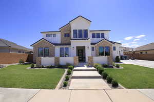 View of front of home featuring a front yard