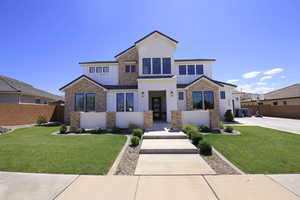 View of front of property with a front lawn