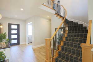 Entryway with hardwood / wood-style flooring