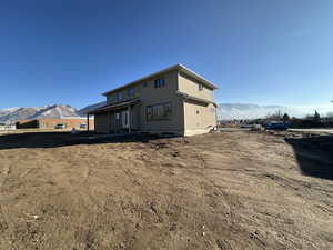 Rear view of property featuring a mountain view