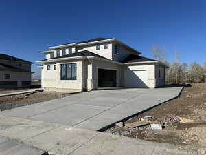 Prairie-style house with a garage