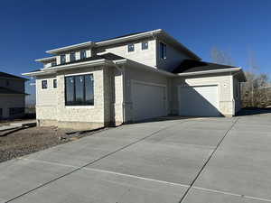 View of side of home with a garage