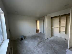 Unfurnished bedroom featuring a closet