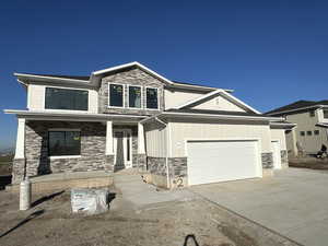 View of front of property featuring a garage