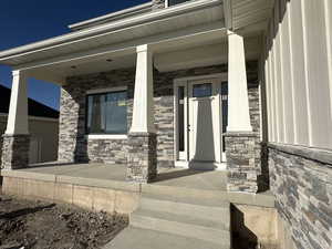 Entrance to property with a porch