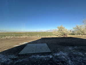 View of yard with a mountain view and a rural view