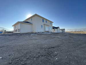 Rear view of house featuring a mountain view