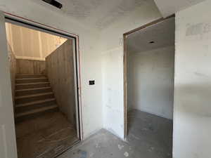 Stairs featuring concrete floors