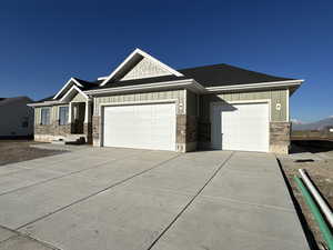 View of front of property featuring a garage