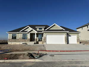 View of front of home featuring a 3 car garage