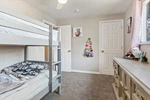 Bed 2 Carpeted bedroom featuring ceiling fan