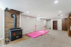 Downstairs family room wood stove, and a textured ceiling