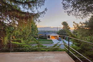 Exterior space with a balcony and a mountain view