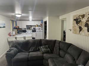 Living room featuring brick wall