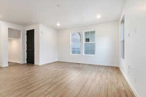 Spare room with light wood-type flooring