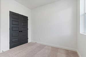 Foyer entrance with carpet floors