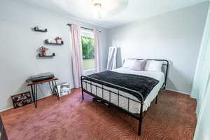 Bedroom with carpet and ceiling fan