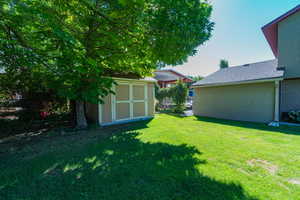 View of yard featuring a storage shed