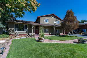 View of front of property with a front lawn