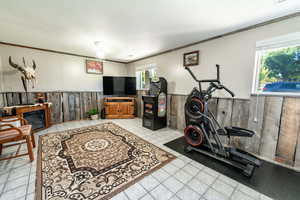 Workout room featuring light tile patterned flooring