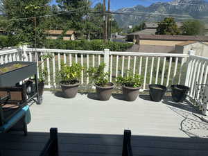 Backyard deck featuring a mountain view and a shed