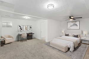 Carpeted bedroom featuring a textured ceiling and ceiling fan-Virtual Stage