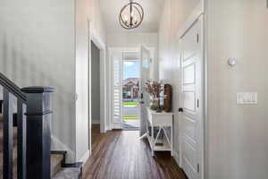 Entryway with an inviting chandelier