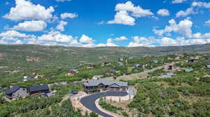 Birds eye view of property featuring a mountain view