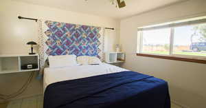 Primary bedroom featuring walk in closet and on suite bathroom