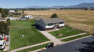 Aerial view featuring a rural view and a mountain view