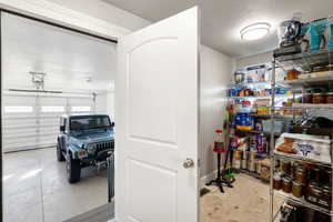 Garage view and pantry area or main floor laundry hookups available as well.