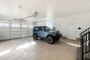 Garage with epoxy floors and extra insulation. Garage door opener