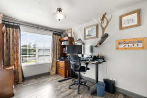 Bedroom featuring a textured ceiling and light hardwood / wood-style flooring