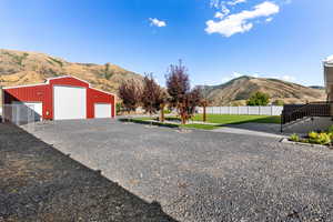 Garage with a lawn and a mountain view