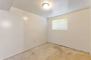 Unfurnished room in basement.